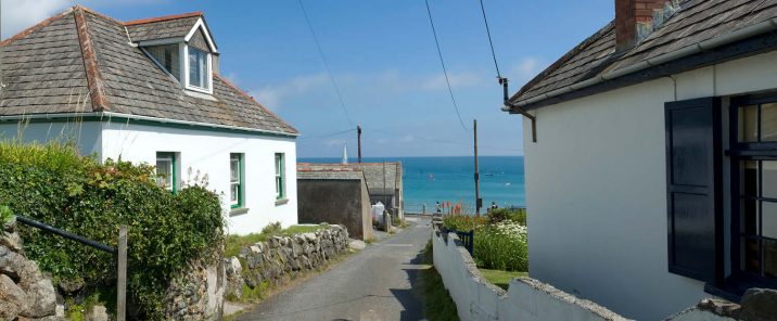 holiday home rental example - white cottage with coastal view