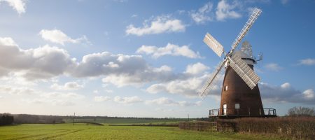 blue sky green fields windmill landscape photo