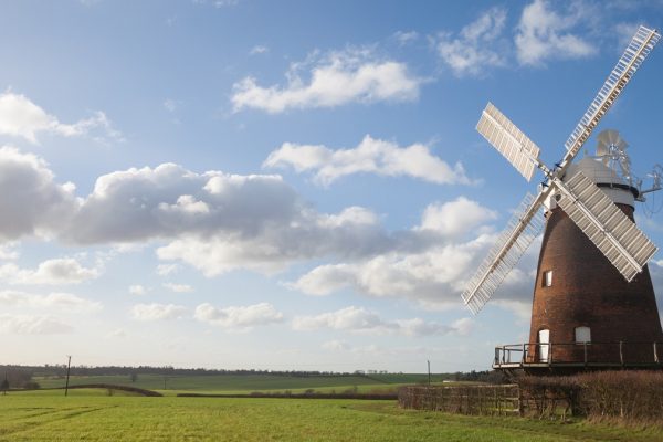 blue sky green fields windmill landscape photo