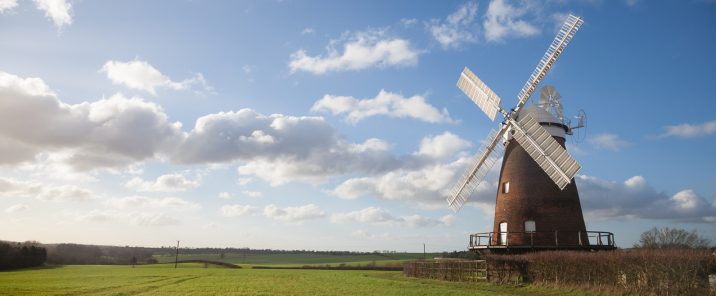 blue sky green fields windmill landscape photo