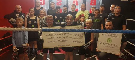 Mansfield All Star Amateur Boxing Club children holding cheque