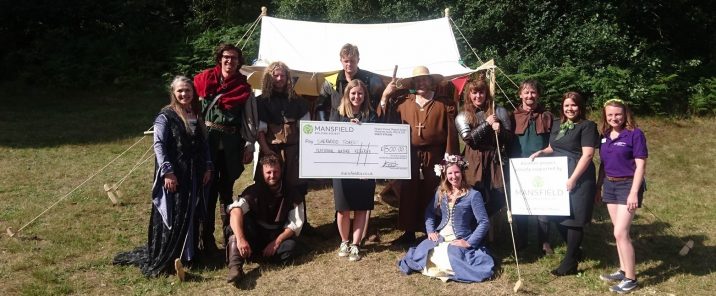 Sherwood forest nature reserve staff holding cheque img 1