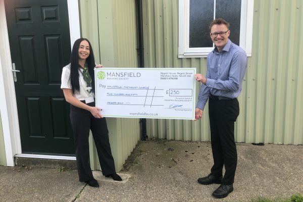 Hillstown methodist church man and woman holding mansfield cheque