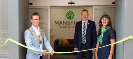 Man cutting ribbon to mansfield building society