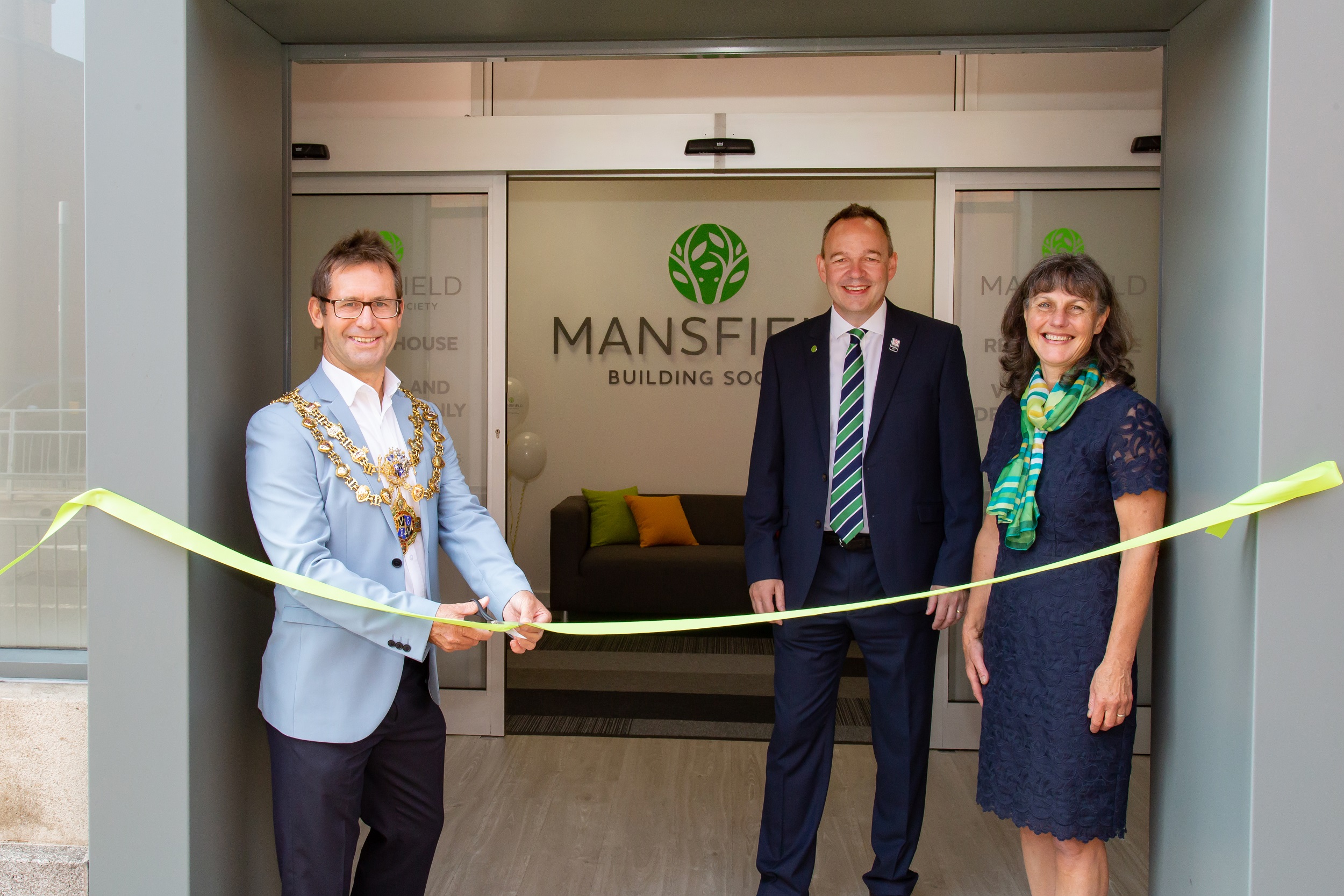 Man cutting ribbon to mansfield building society