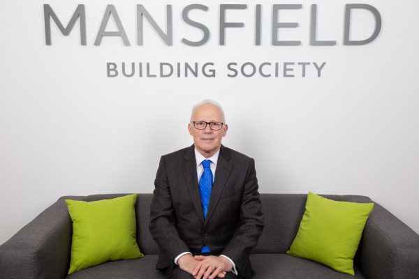 Mansfield Building Society Colin Bradley sitting on sofa