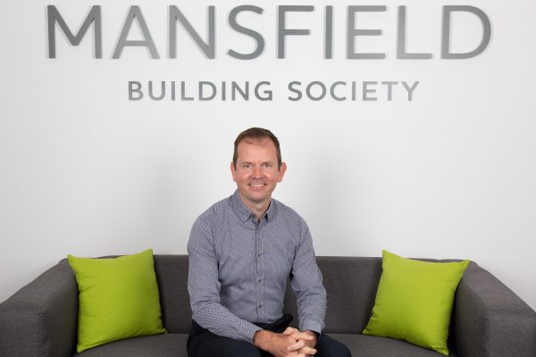 Mansfield Building Society Dan Jones sitting on sofa