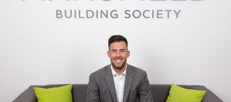 Mansfield Building Society Tom Denman Molloy sitting on sofa