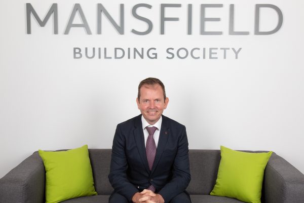 Mansfield Building Society Dan Jones sitting on sofa