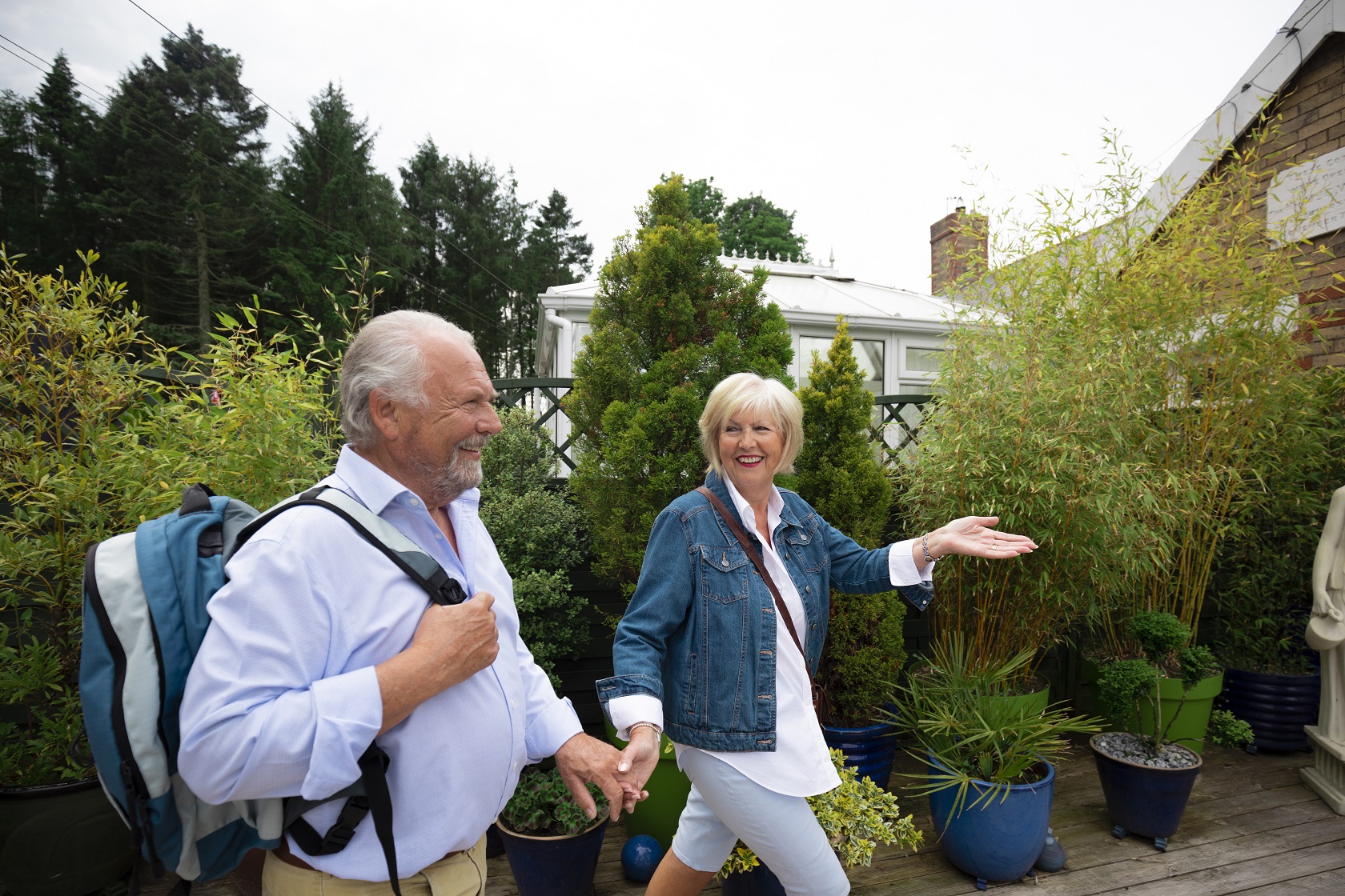 Elderly couple walking in garden