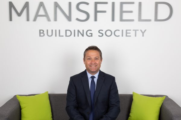 Mansfield Building Society Richard Crisp sitting on sofa