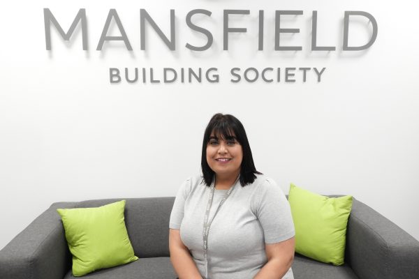 Mansfield Building Society Sabiha Moghal sitting on sofa