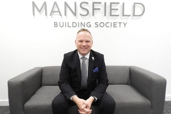 Mansfield Building Society Iain Lister sitting on sofa