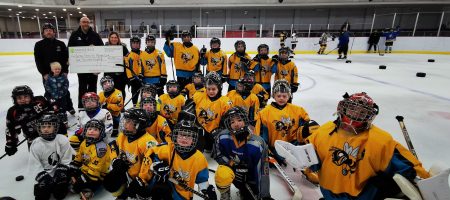 Sutton stings kids hockey team on ice with large cheque