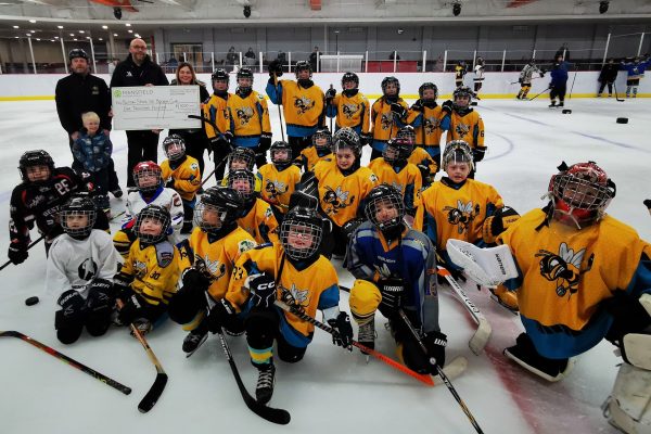 Sutton stings kids hockey team on ice with large cheque