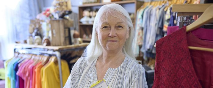 Senior Female Volunteer Working In Charity Shop