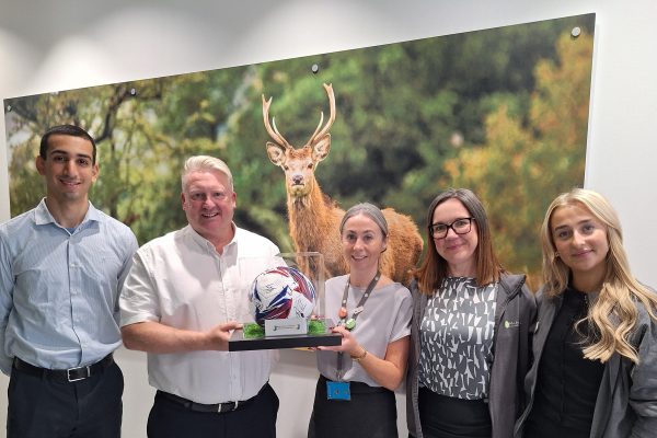 Members of Mansfield Town FC and Mansfield Building Society celebrate the partnership for 2026-27